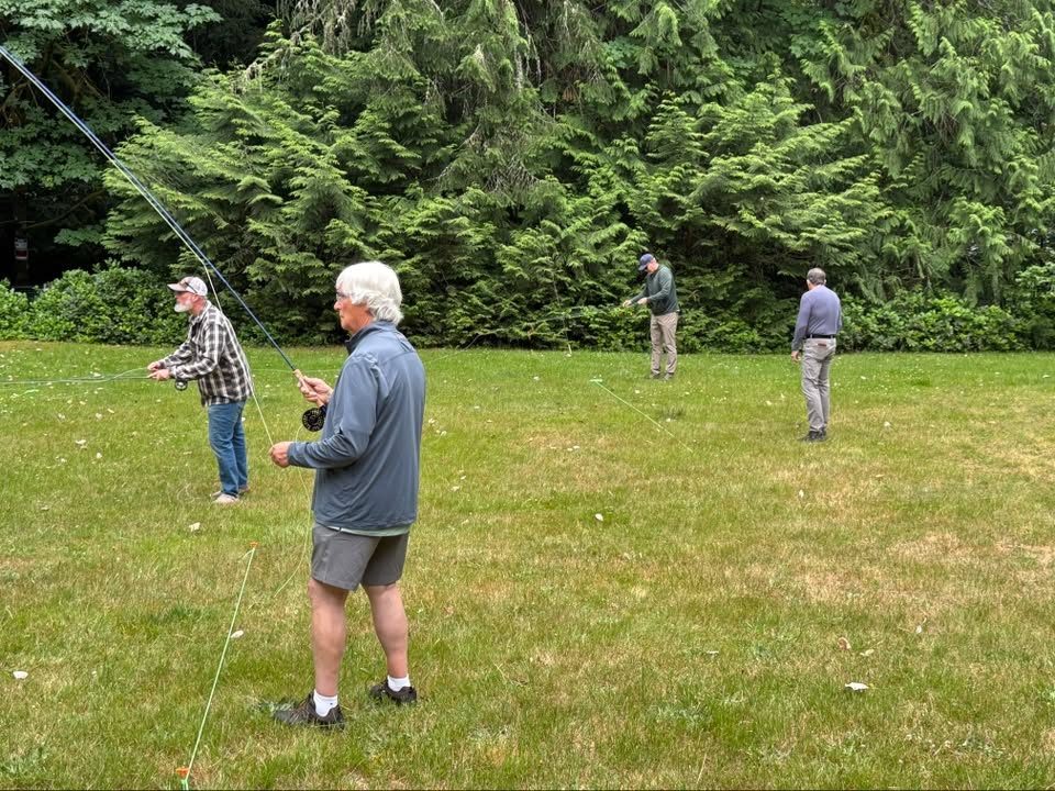 Club members gathered on the lawn at a summer picnic